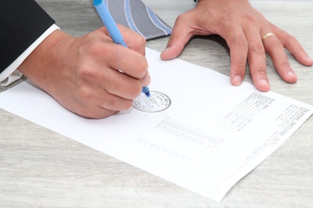 Notary signing a notarized document.
