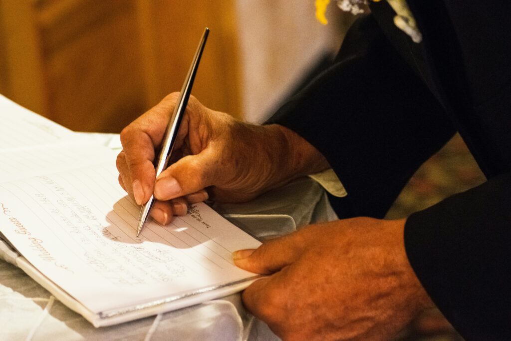 gentleman signing a document